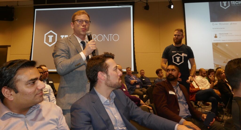 speaker engages with audience at Toronto tech convention
