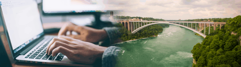 Rainbow bridge next to hands on keyboard